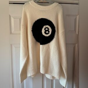 Edikted Cozy White Sweater with Black 8-Ball Design
Size XS 
Oversized